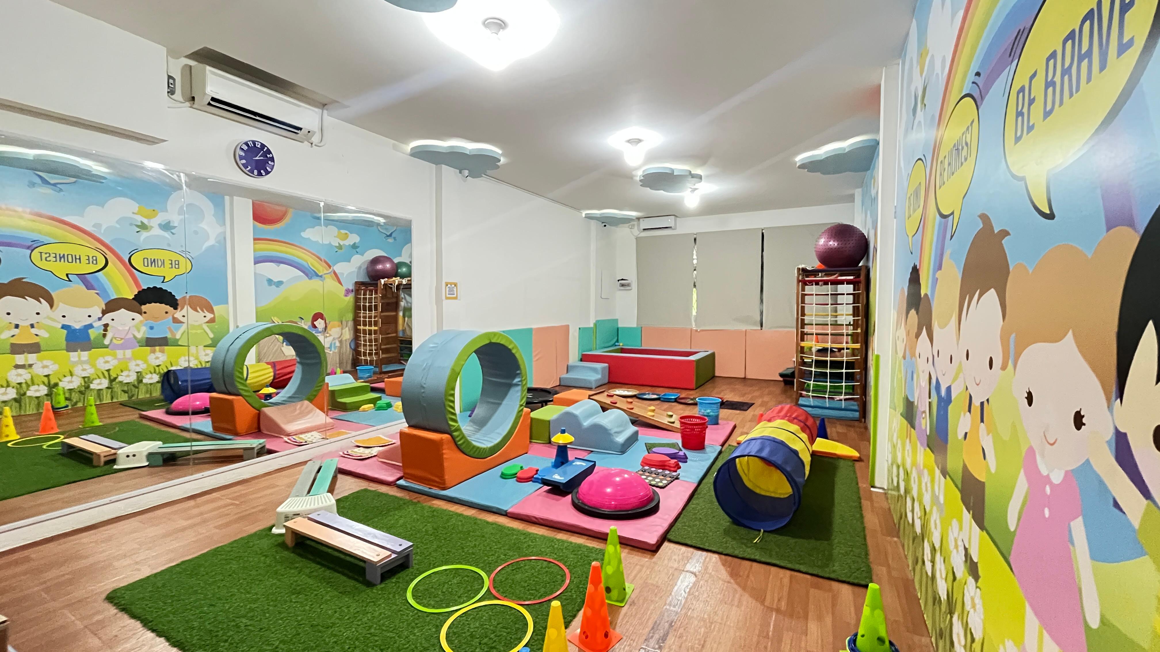 cartoon style modern kids learning center in a mall setting in Jakarta, bright and colorful