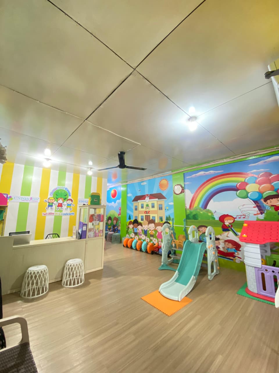 cartoon style modern kids learning center in a mall setting in Jakarta, bright and colorful