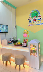 cartoon style modern kids learning center in a mall setting in Jakarta, bright and colorful