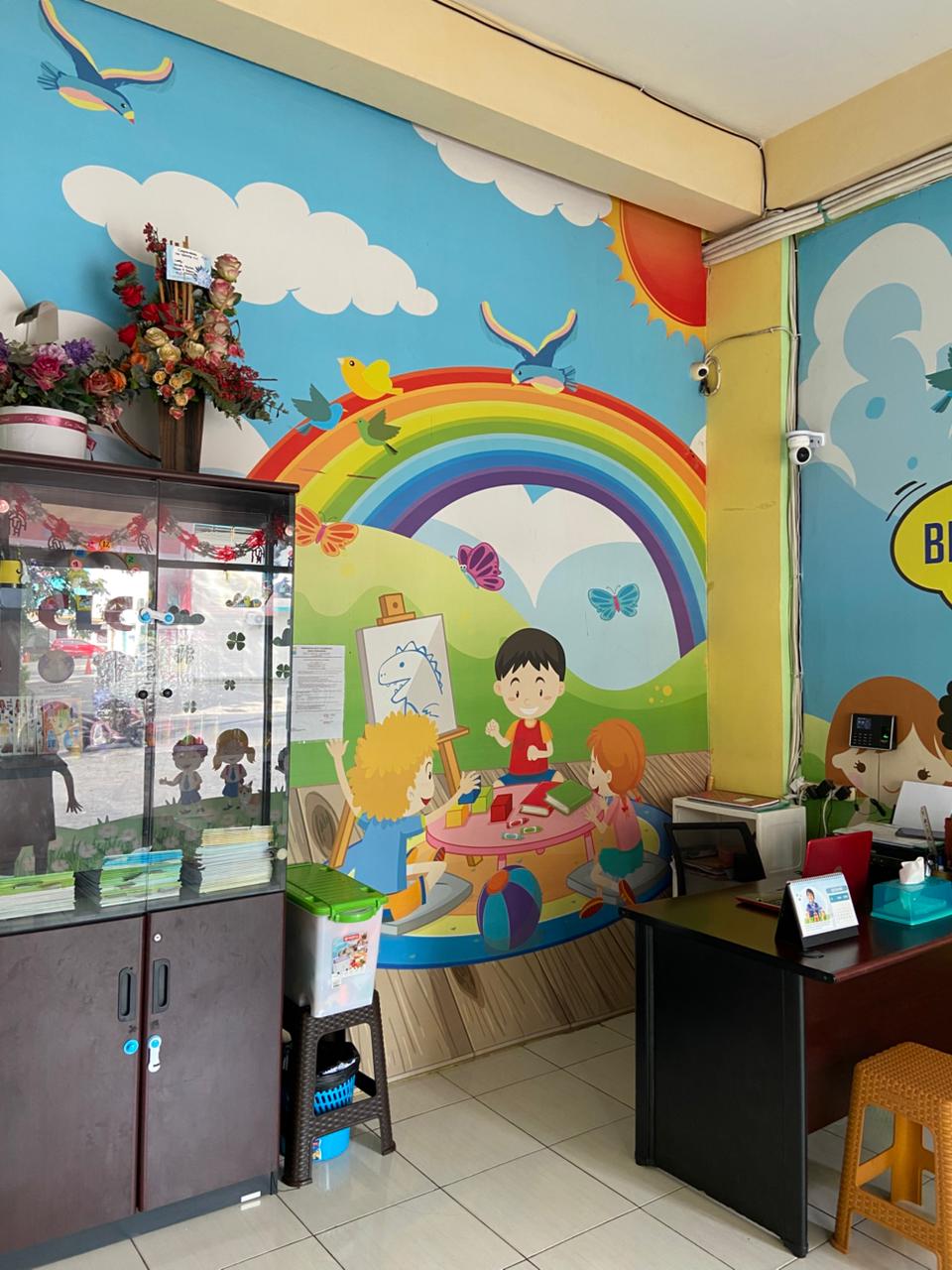 cartoon style modern kids learning center in a mall setting in Jakarta, bright and colorful
