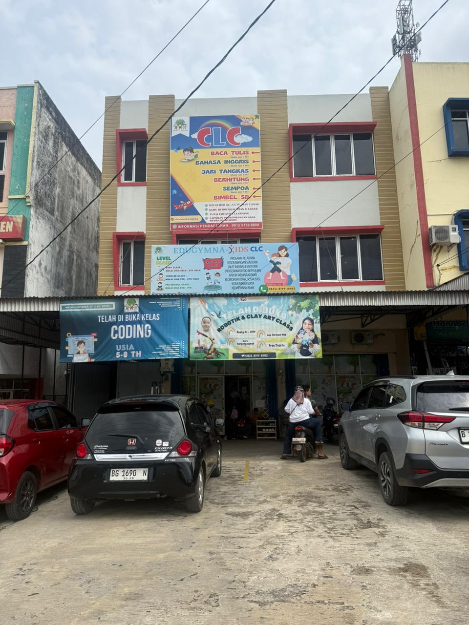 cartoon style modern kids learning center in a mall setting in Jakarta, bright and colorful