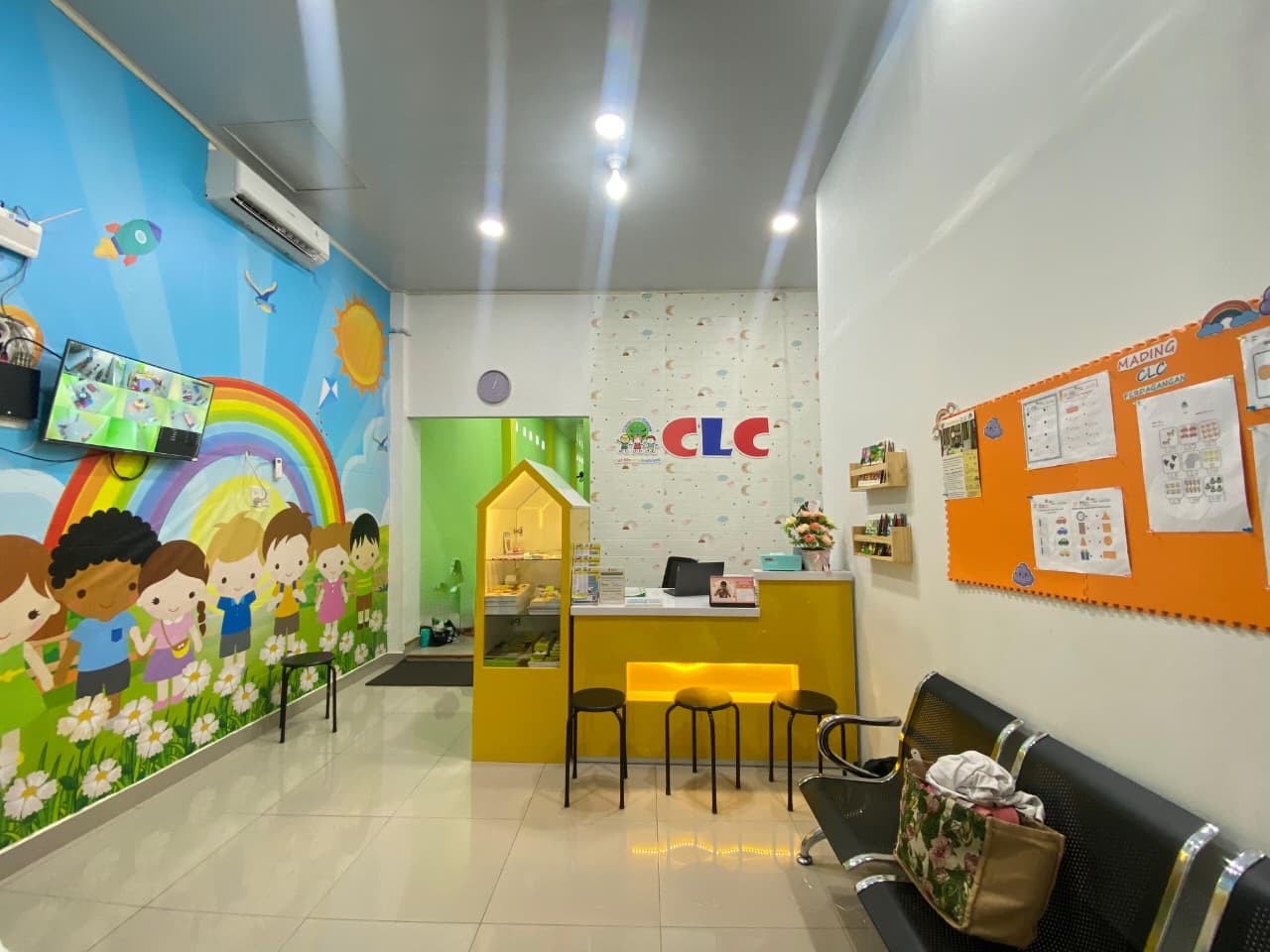 cartoon style modern kids learning center in a mall setting in Jakarta, bright and colorful