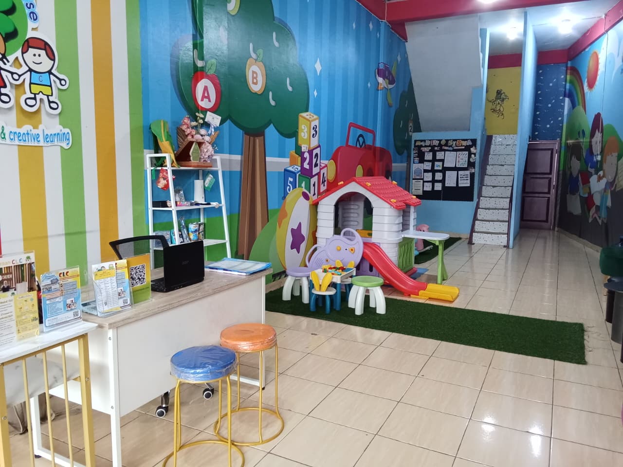 cartoon style modern kids learning center in a mall setting in Jakarta, bright and colorful