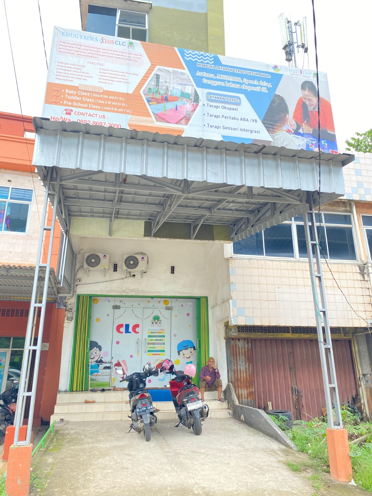 cartoon style modern kids learning center in a mall setting in Jakarta, bright and colorful