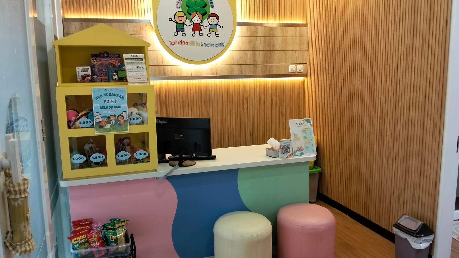 cartoon style modern kids learning center in a mall setting in Jakarta, bright and colorful
