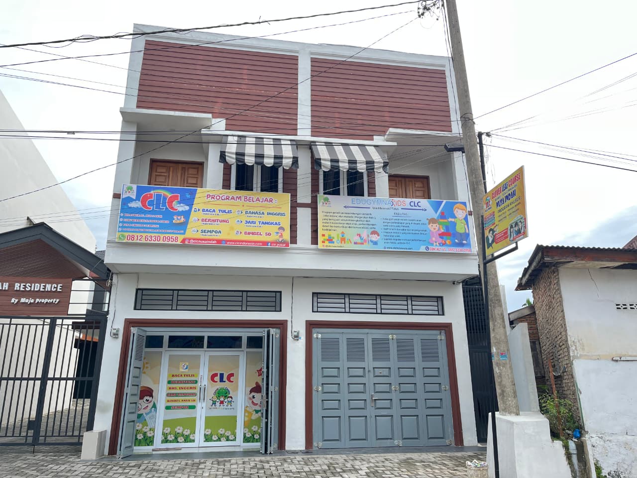 cartoon style modern kids learning center in a mall setting in Jakarta, bright and colorful