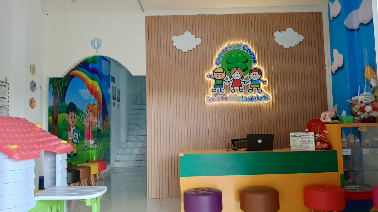 cartoon style modern kids learning center in a mall setting in Jakarta, bright and colorful