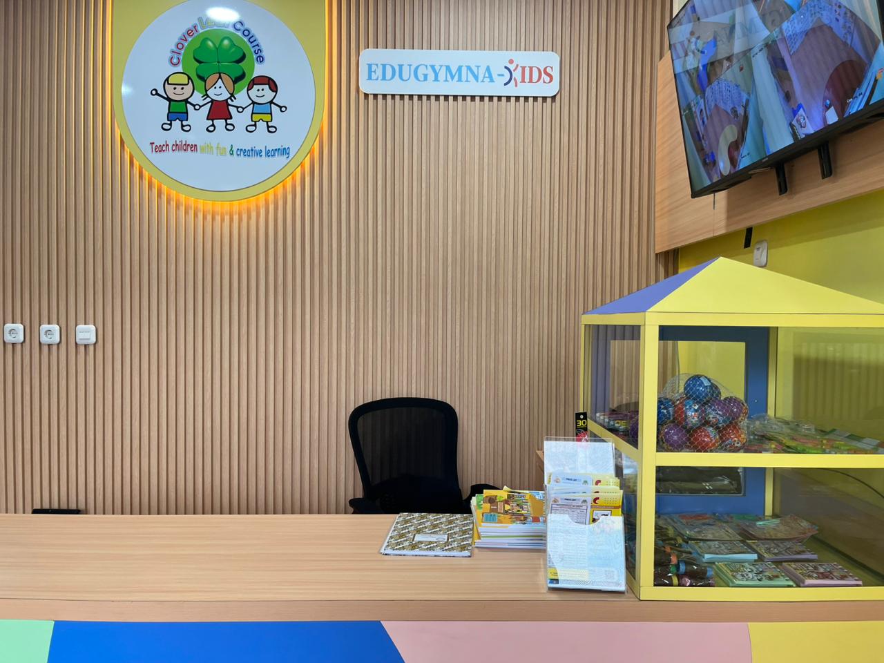 cartoon style modern kids learning center in a mall setting in Jakarta, bright and colorful