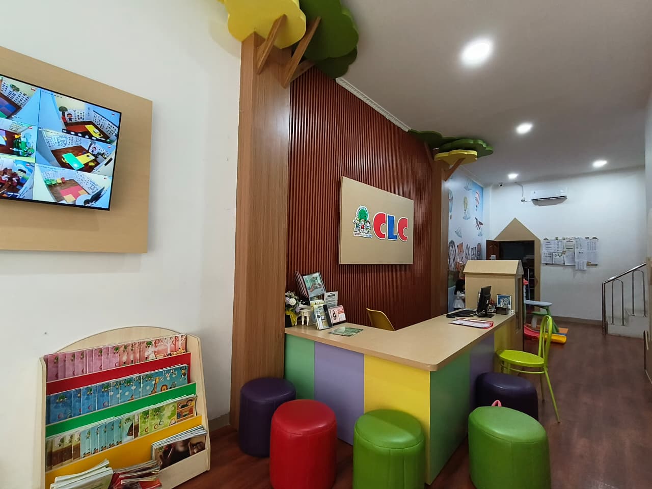 cartoon style modern kids learning center in a mall setting in Jakarta, bright and colorful