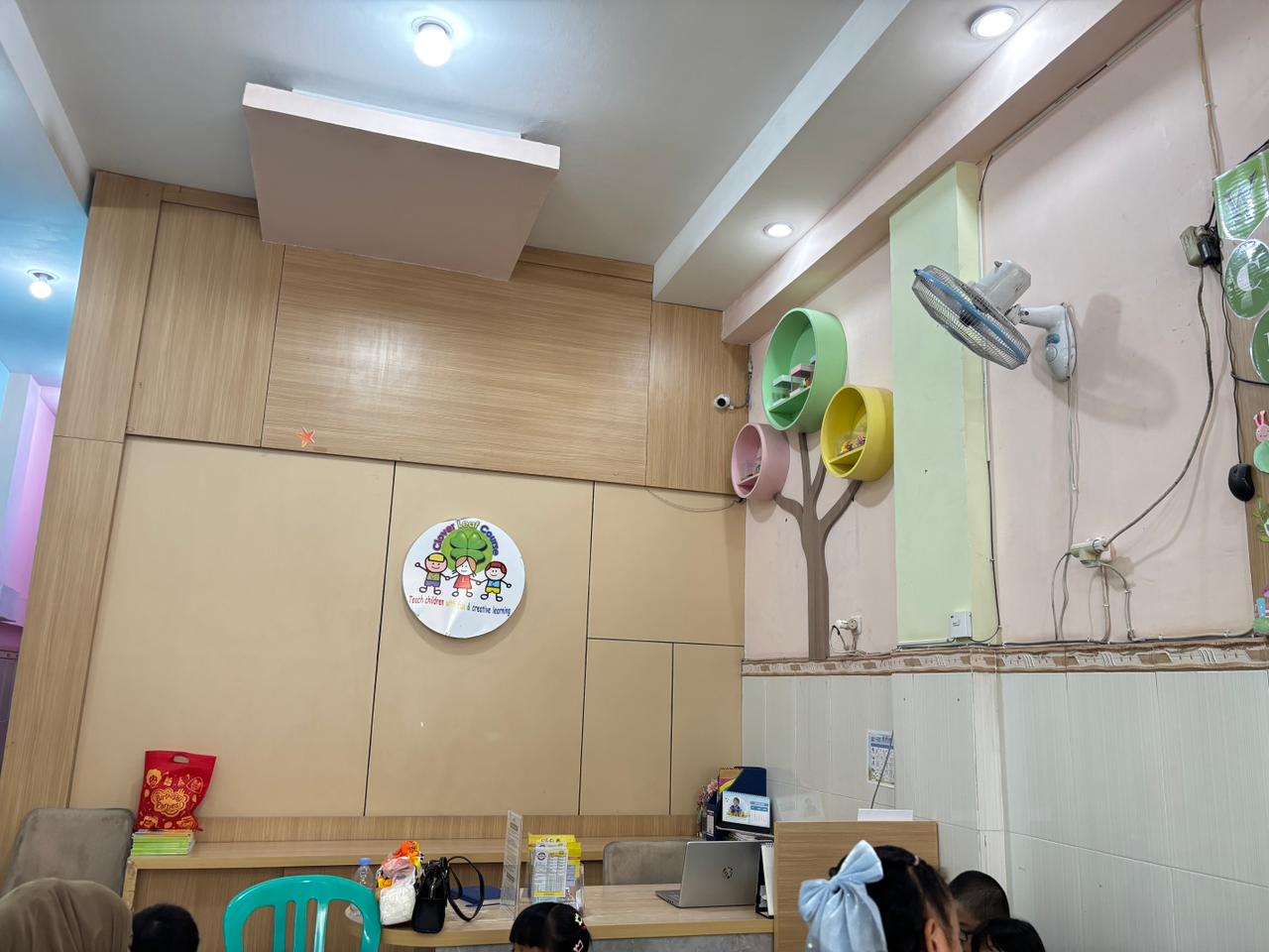 cartoon style modern kids learning center in a mall setting in Jakarta, bright and colorful