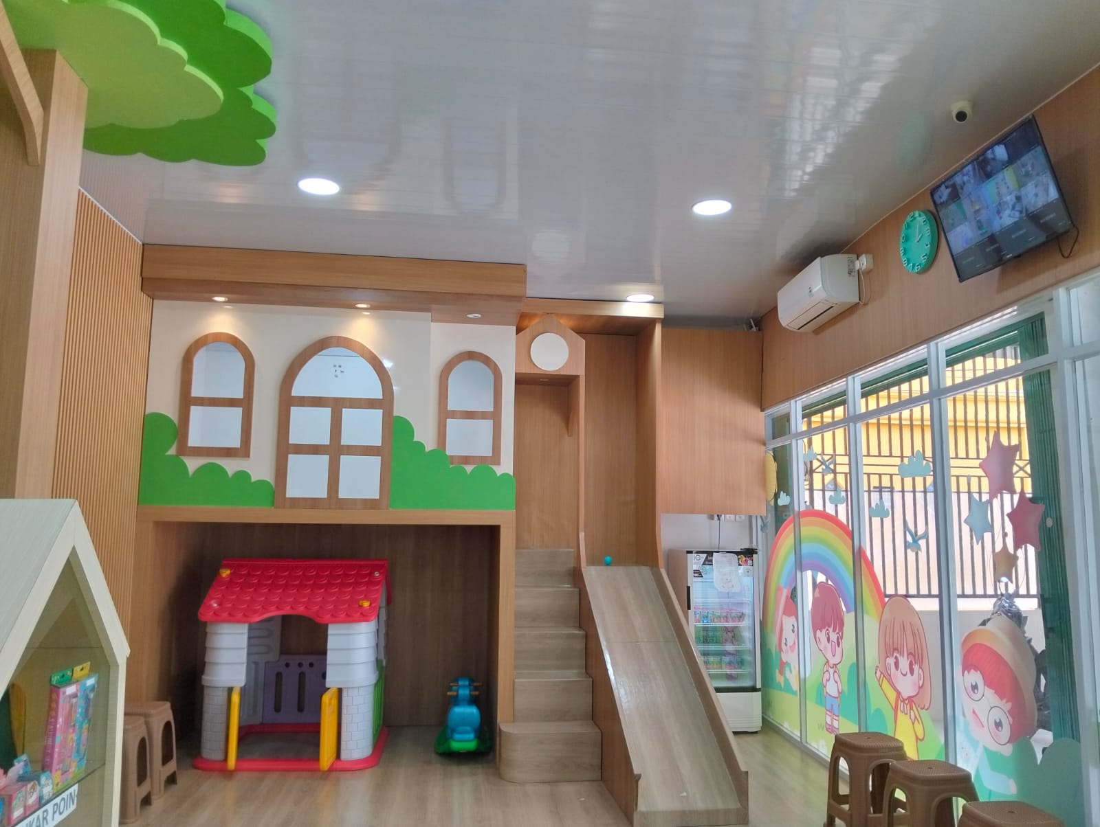 cartoon style modern kids learning center in a mall setting in Jakarta, bright and colorful