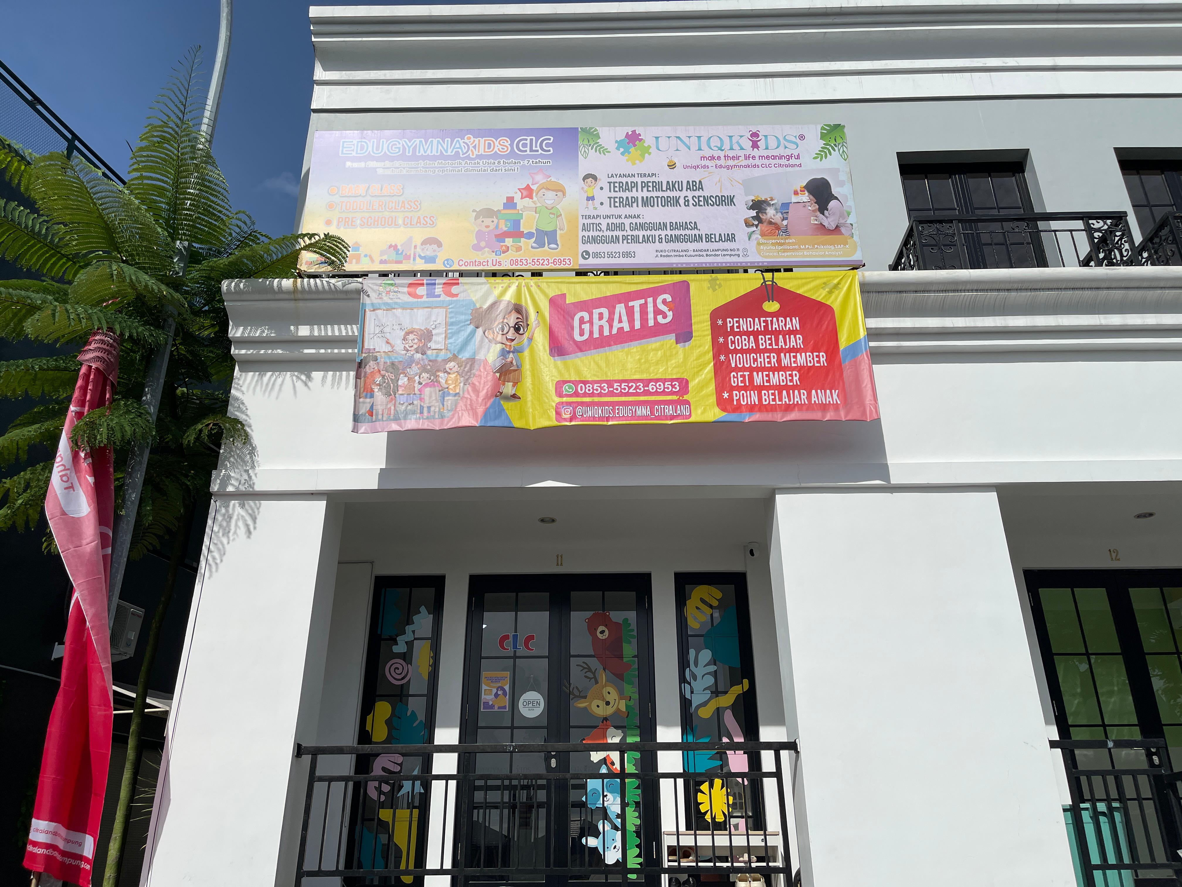 cartoon style modern kids learning center in a mall setting in Jakarta, bright and colorful