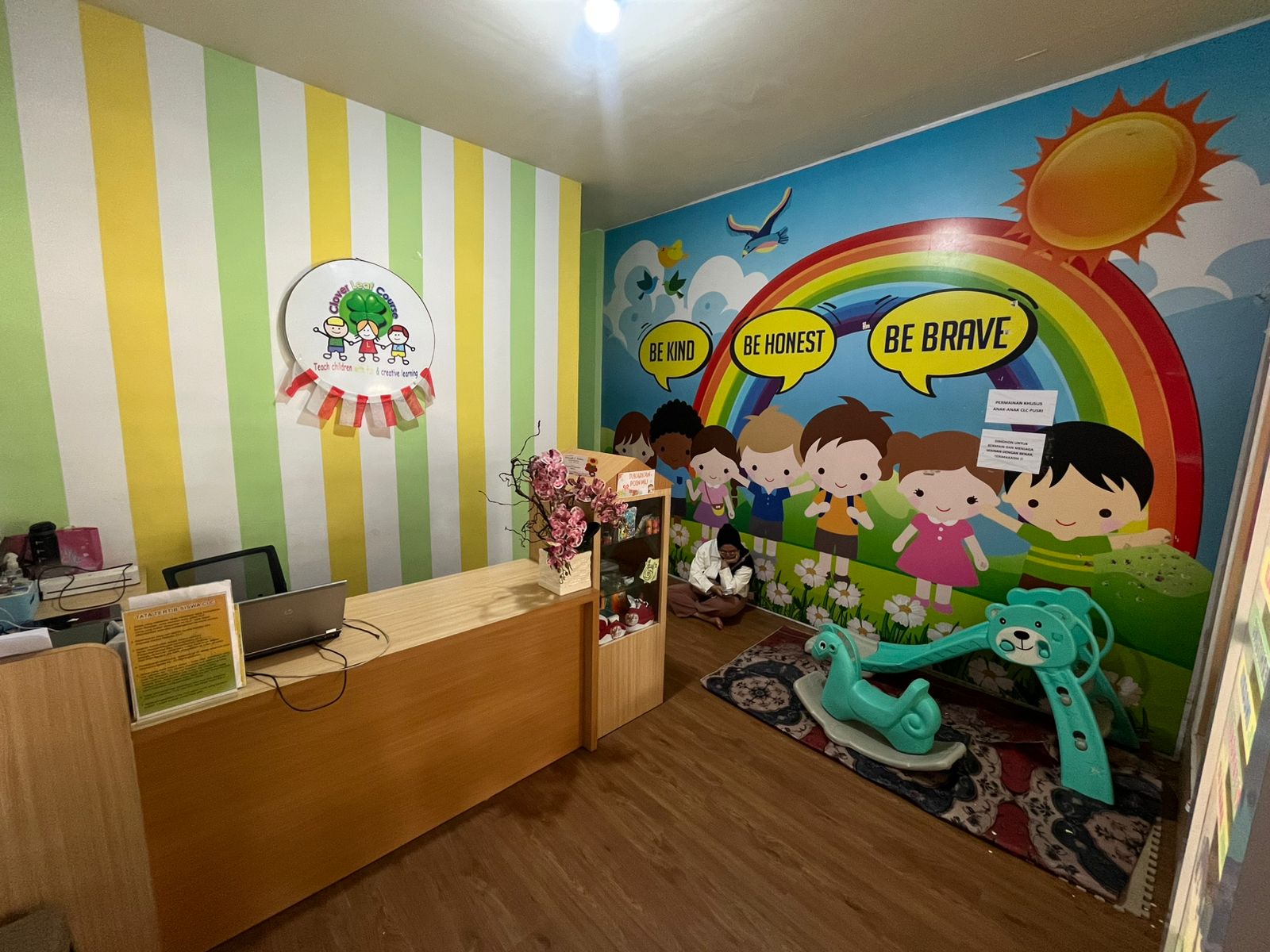 cartoon style modern kids learning center in a mall setting in Jakarta, bright and colorful
