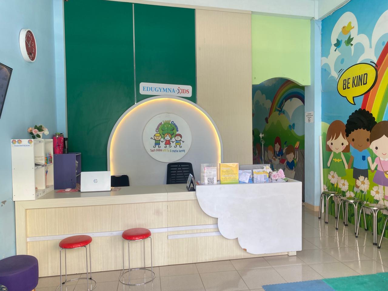 cartoon style modern kids learning center in a mall setting in Jakarta, bright and colorful