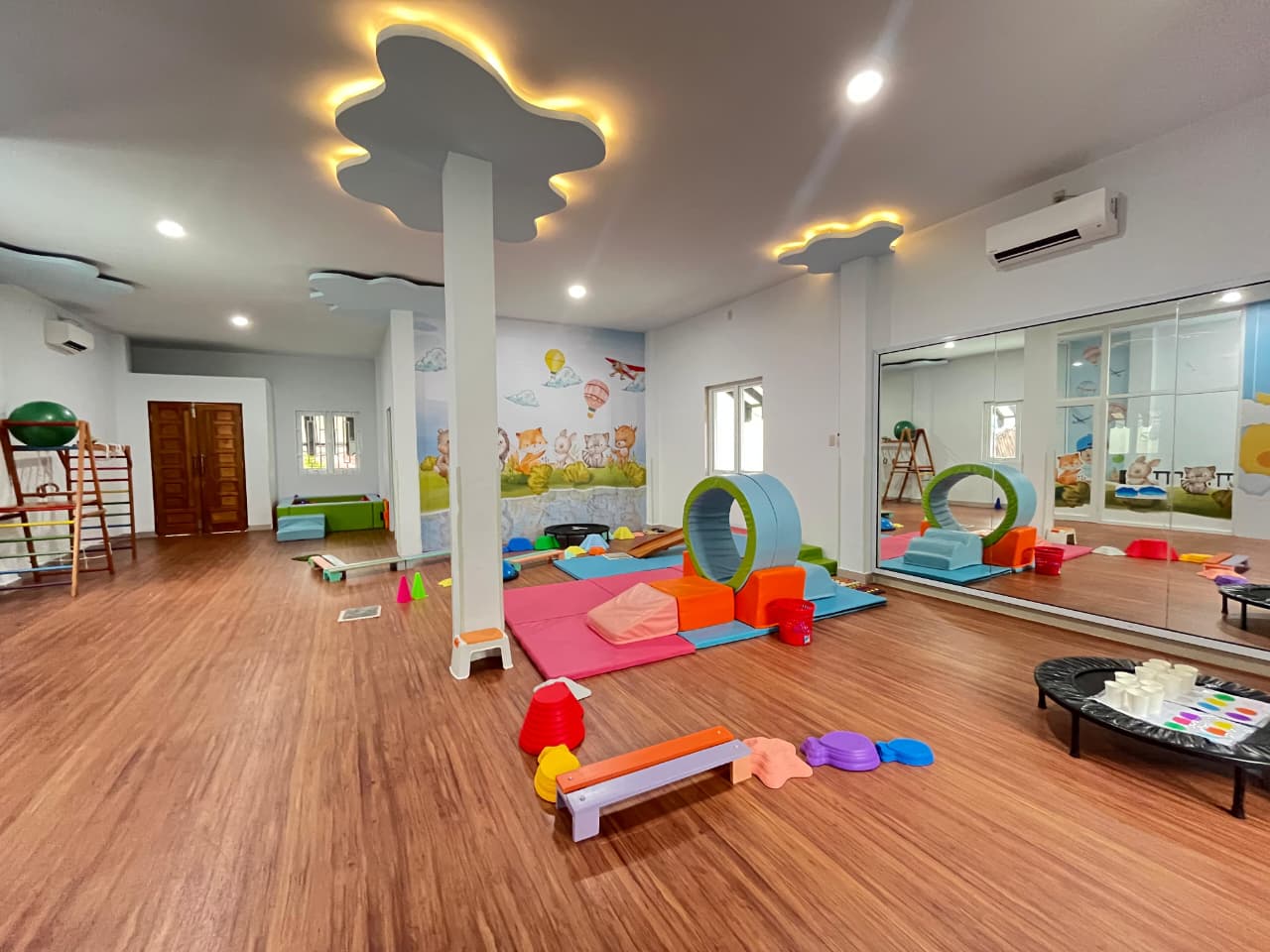 cartoon style modern kids learning center in a mall setting in Jakarta, bright and colorful