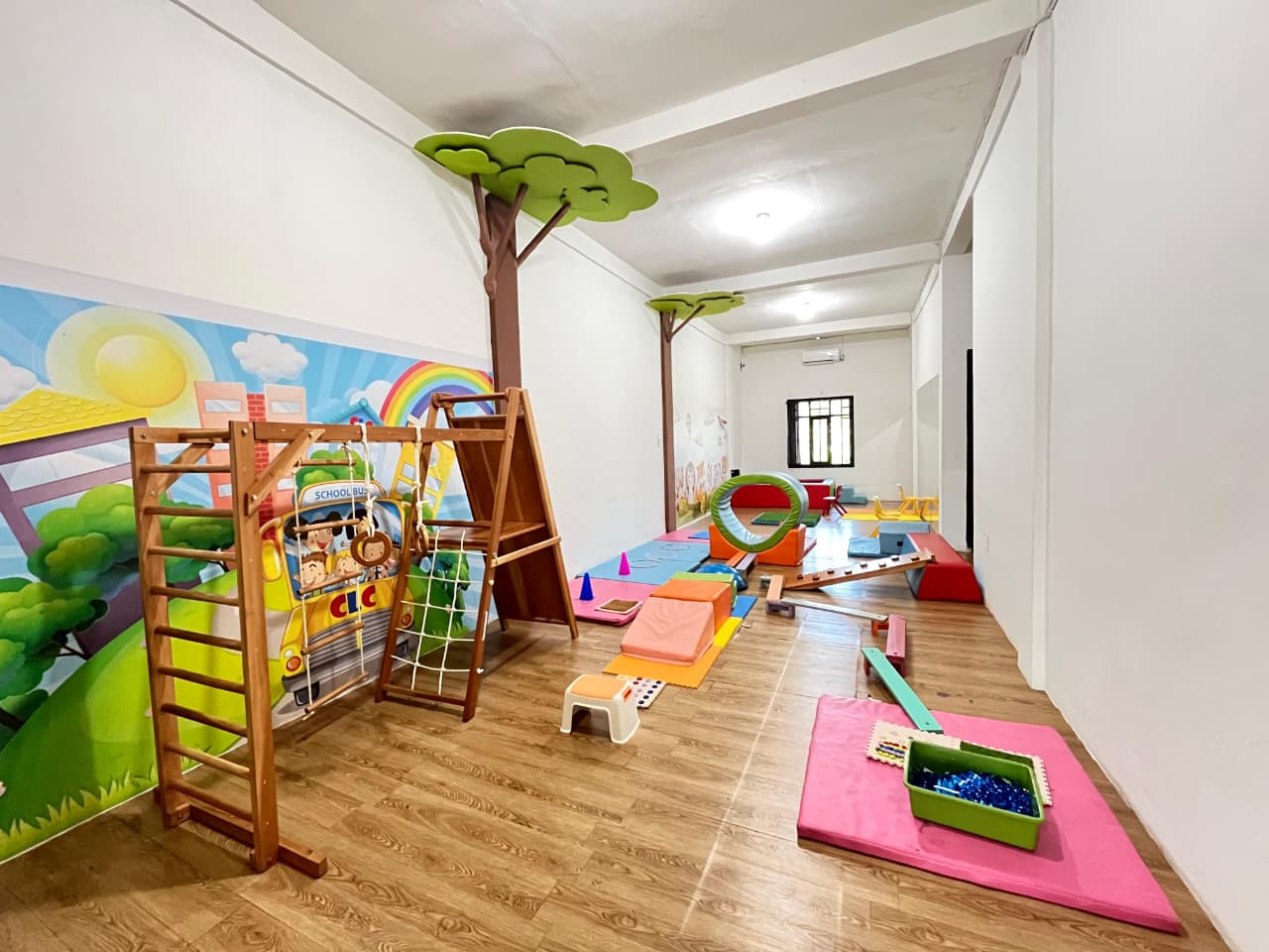 cartoon style modern kids learning center in a mall setting in Jakarta, bright and colorful