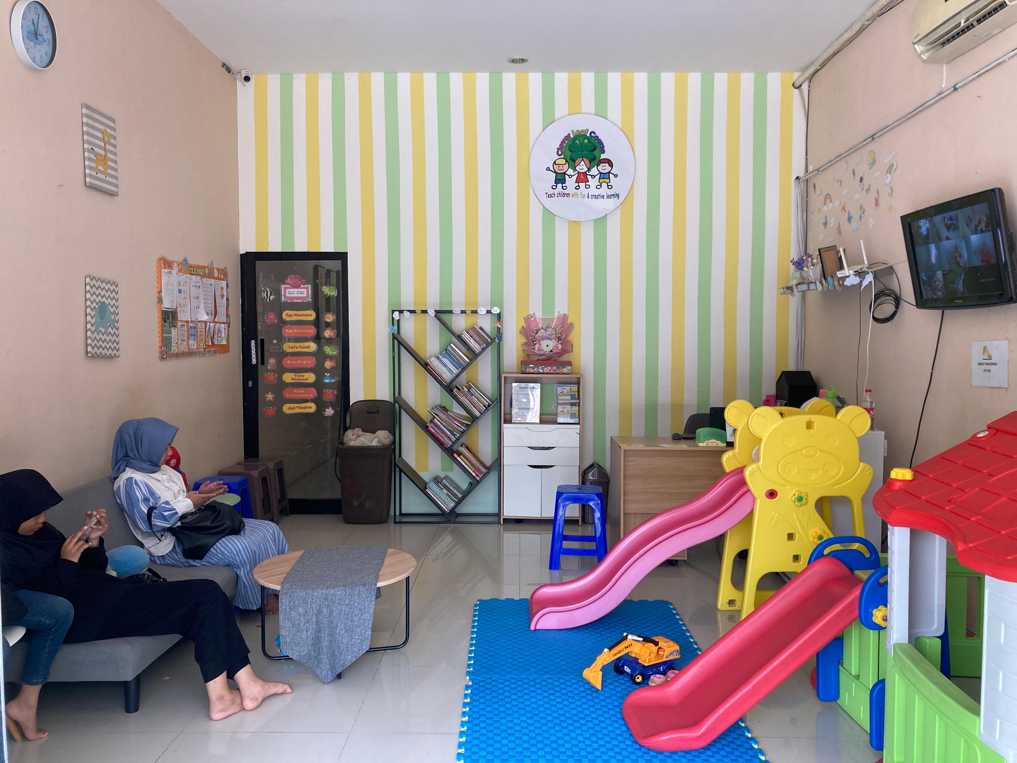 cartoon style modern kids learning center in a mall setting in Jakarta, bright and colorful