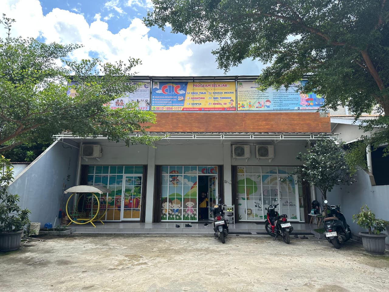 cartoon style modern kids learning center in a mall setting in Jakarta, bright and colorful