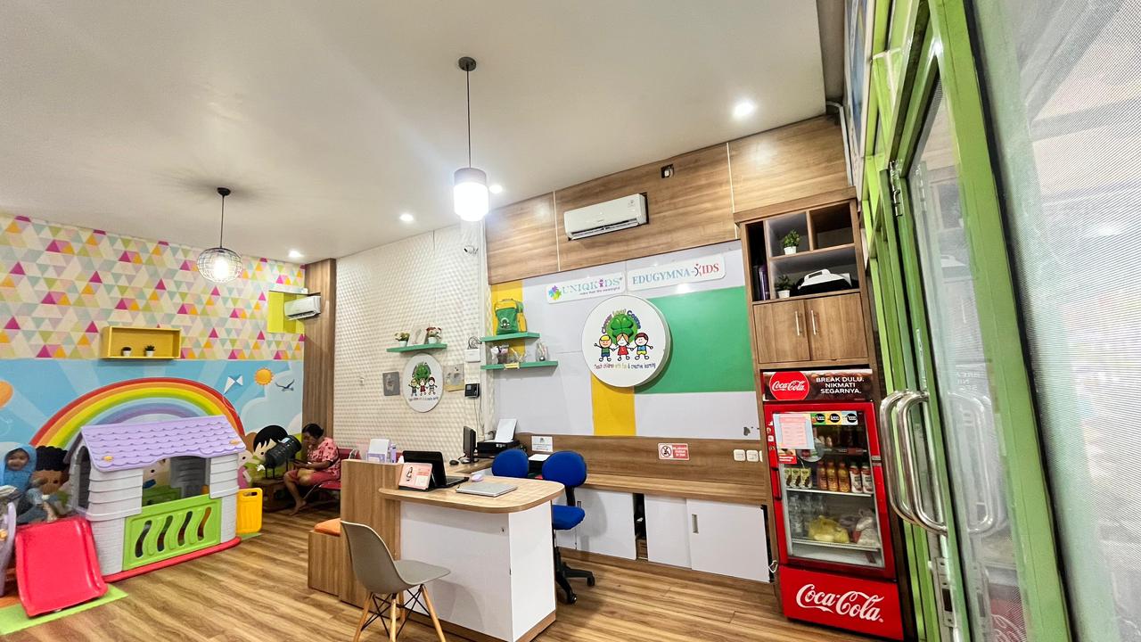 cartoon style modern kids learning center in a mall setting in Jakarta, bright and colorful