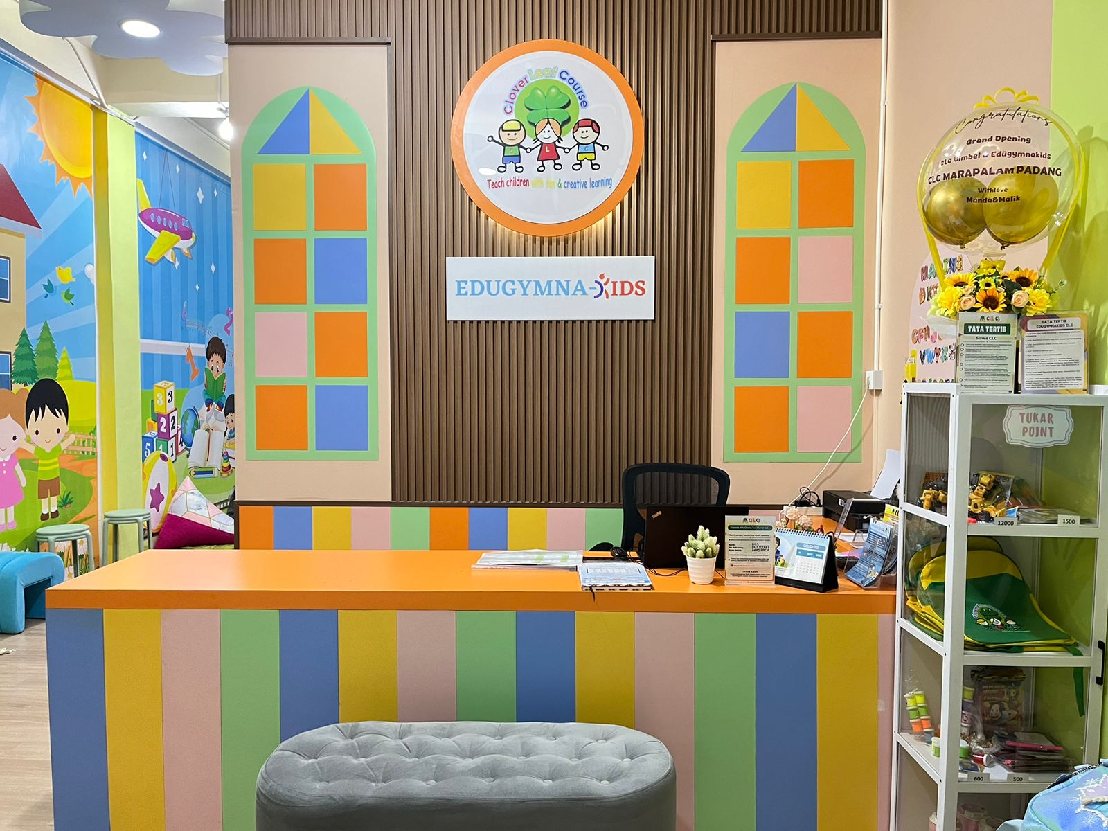 cartoon style modern kids learning center in a mall setting in Jakarta, bright and colorful