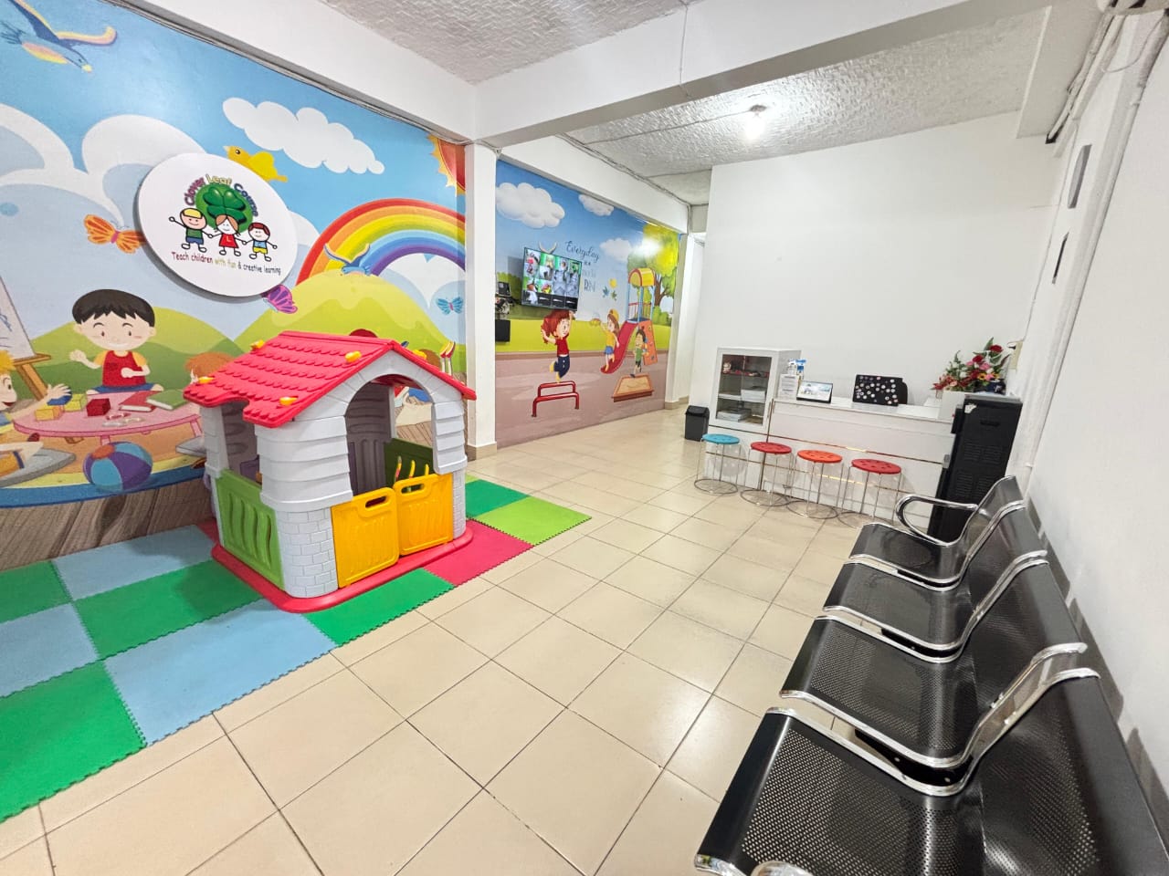 cartoon style modern kids learning center in a mall setting in Jakarta, bright and colorful