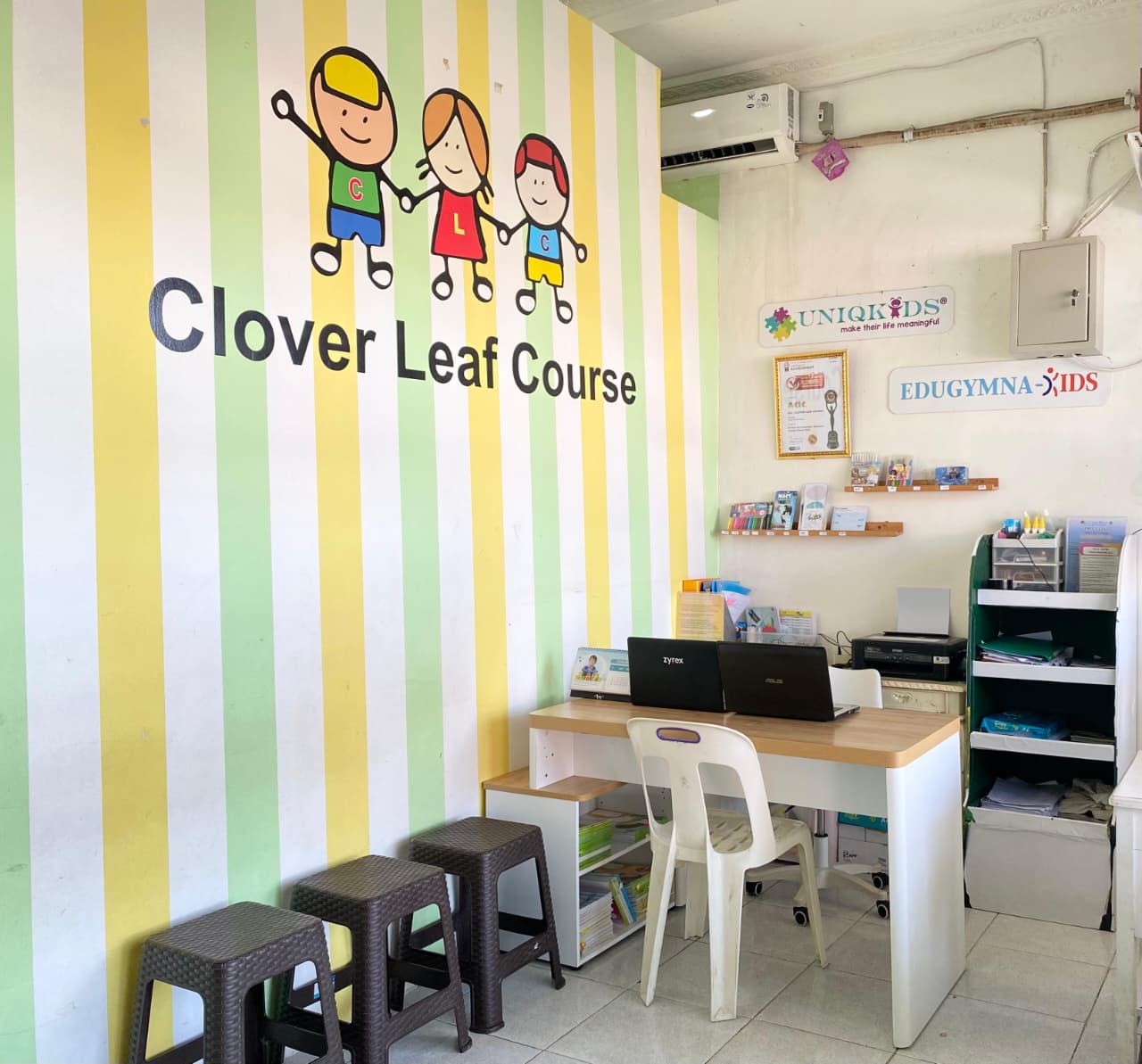 cartoon style modern kids learning center in a mall setting in Jakarta, bright and colorful