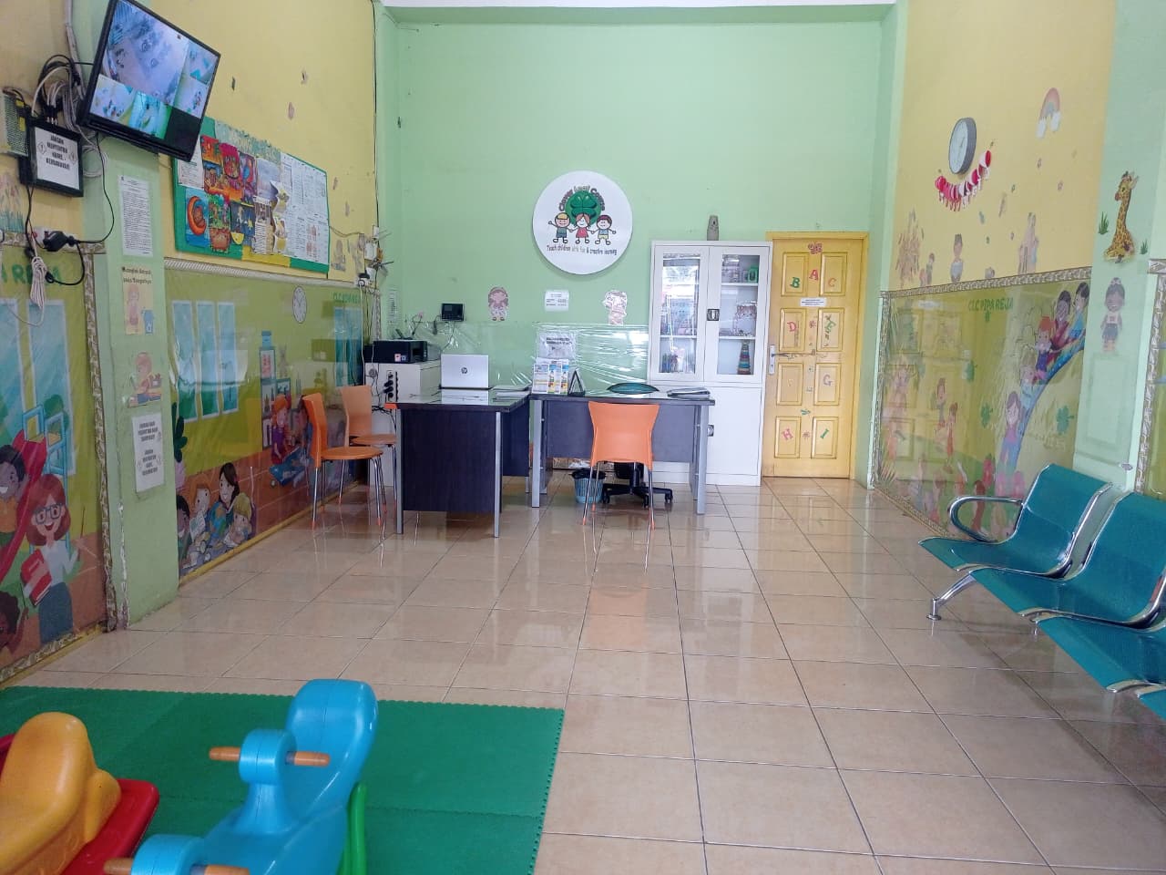 cartoon style modern kids learning center in a mall setting in Jakarta, bright and colorful