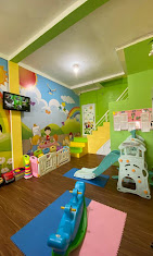 cartoon style modern kids learning center in a mall setting in Jakarta, bright and colorful