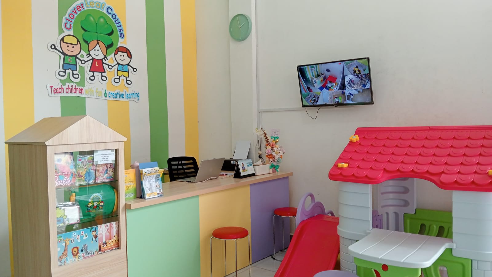 cartoon style modern kids learning center in a mall setting in Jakarta, bright and colorful