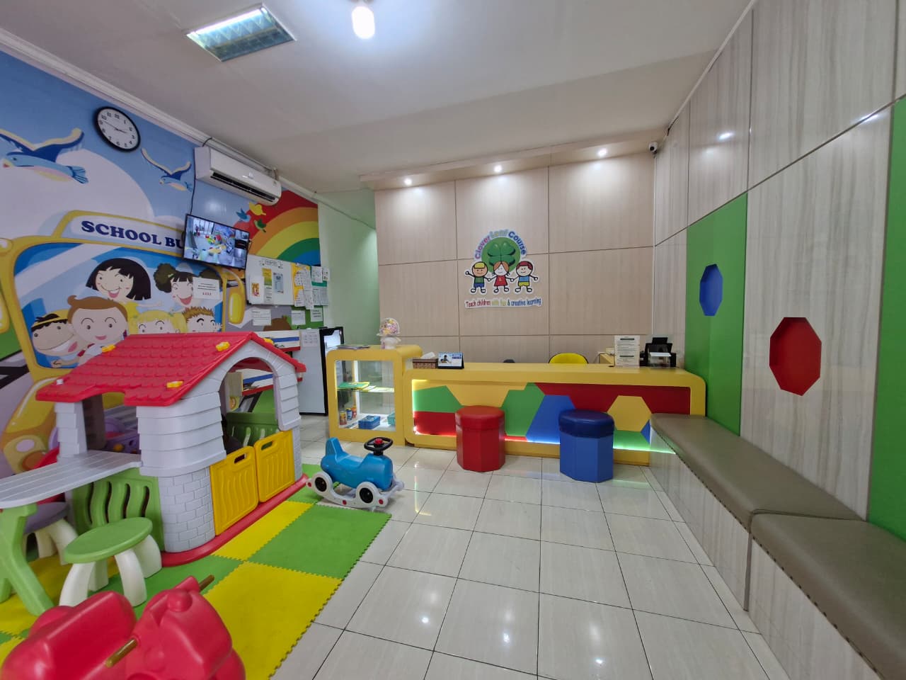 cartoon style modern kids learning center in a mall setting in Jakarta, bright and colorful