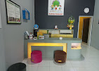 cartoon style modern kids learning center in a mall setting in Jakarta, bright and colorful
