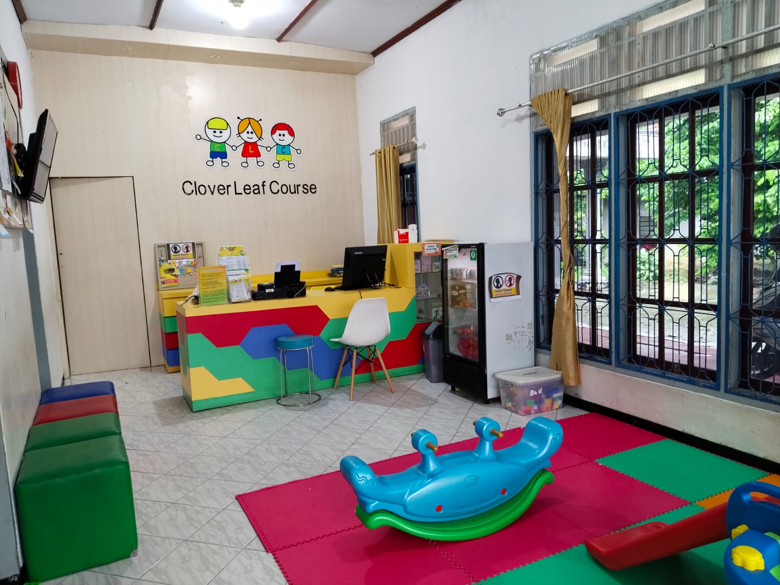 cartoon style modern kids learning center in a mall setting in Jakarta, bright and colorful