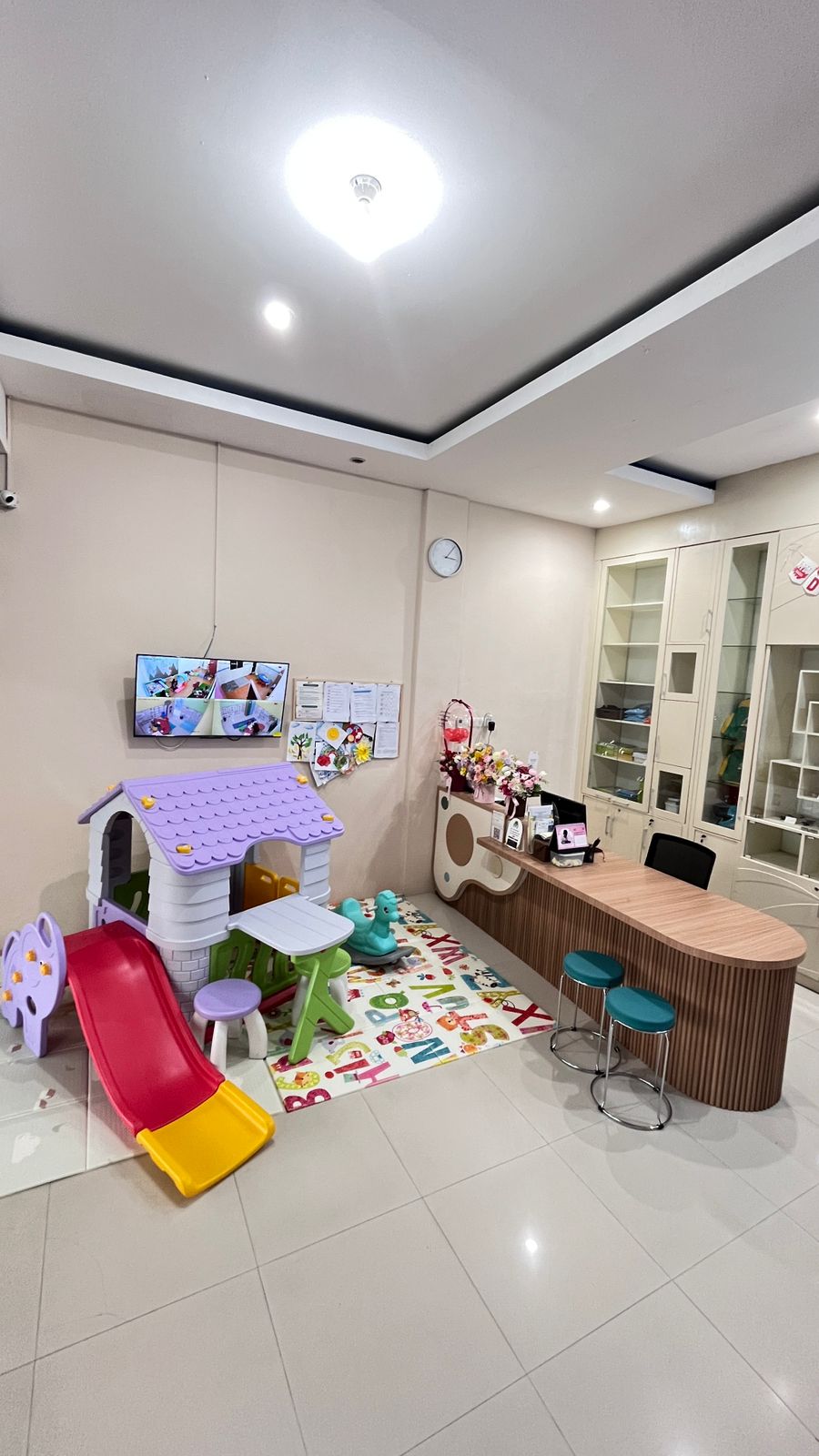 cartoon style modern kids learning center in a mall setting in Jakarta, bright and colorful