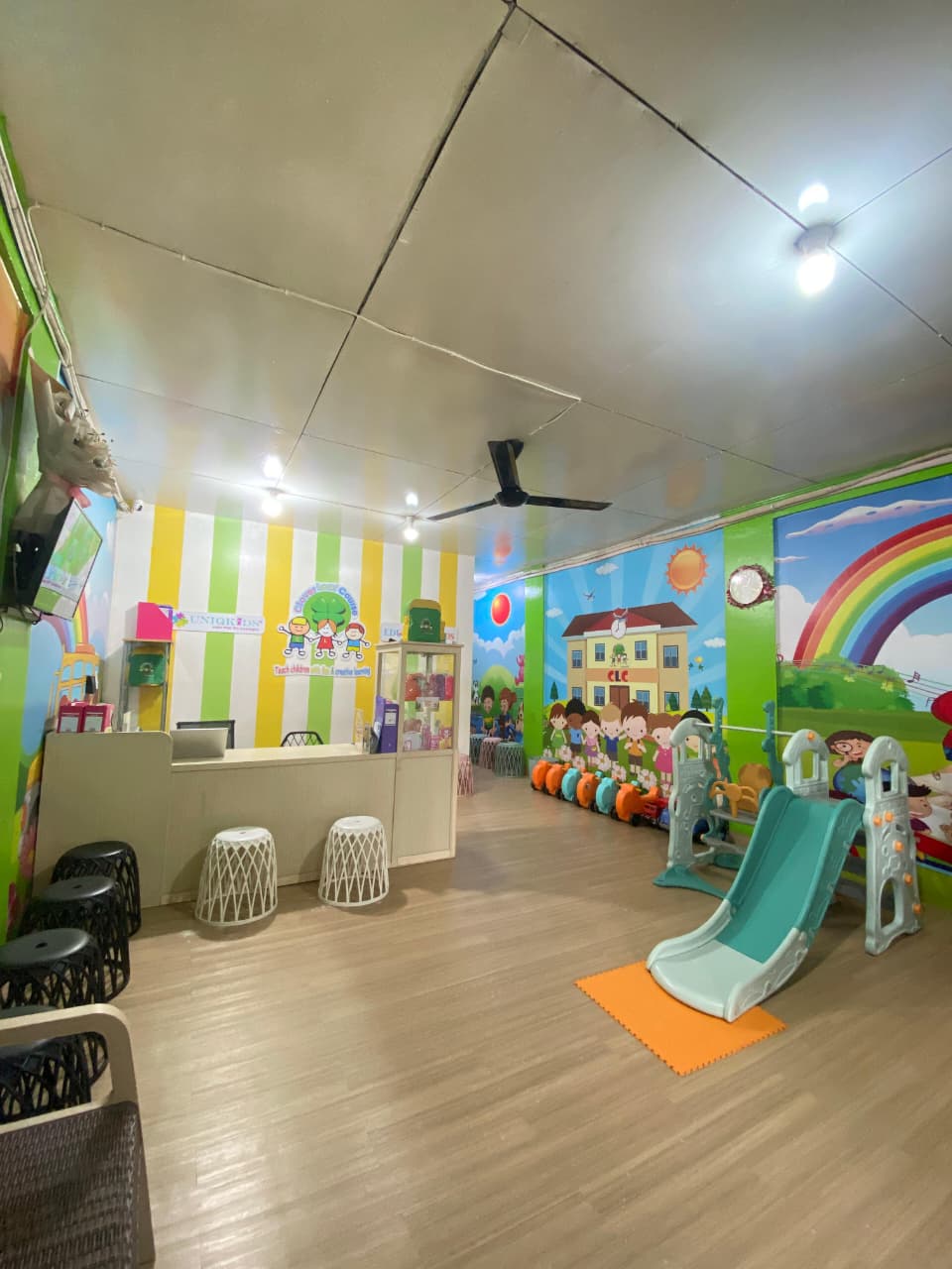 cartoon style modern kids learning center in a mall setting in Jakarta, bright and colorful