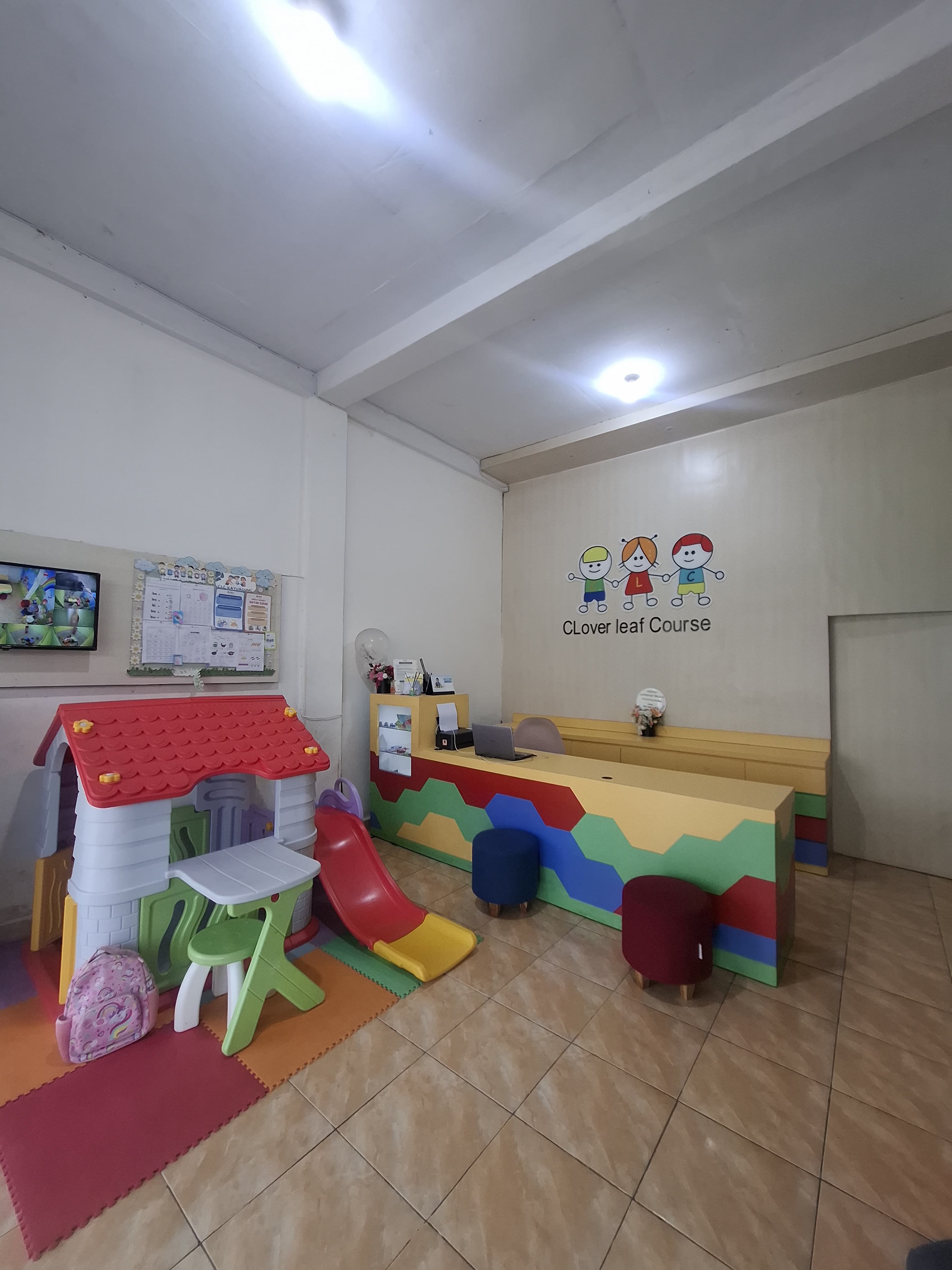 cartoon style modern kids learning center in a mall setting in Jakarta, bright and colorful