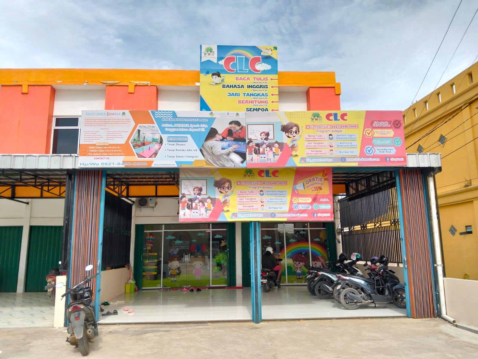 cartoon style modern kids learning center in a mall setting in Jakarta, bright and colorful