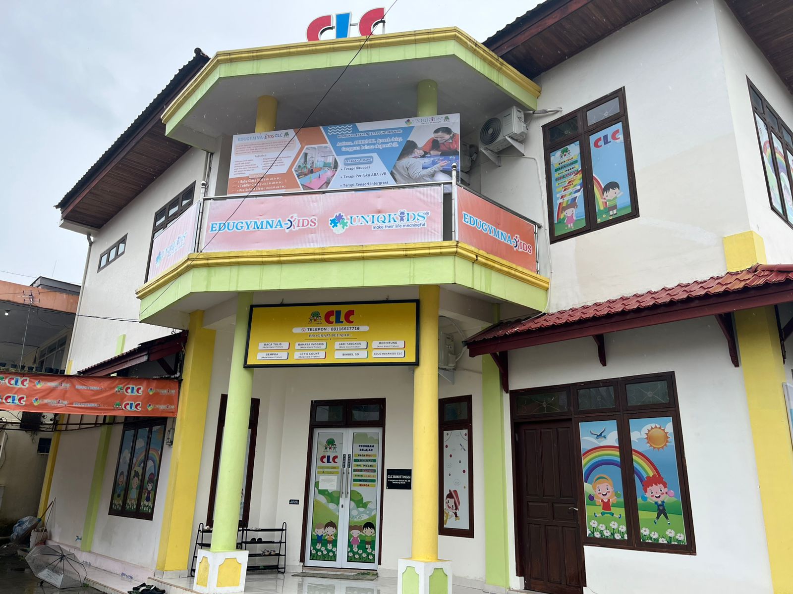 cartoon style modern kids learning center in a mall setting in Jakarta, bright and colorful